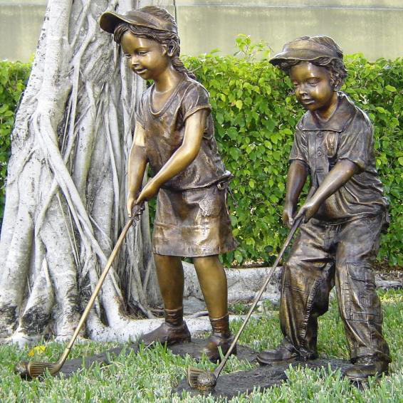 Boy and girl playing golf statue